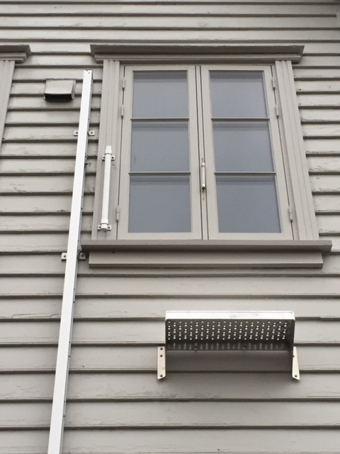 Modum ladder next to a window