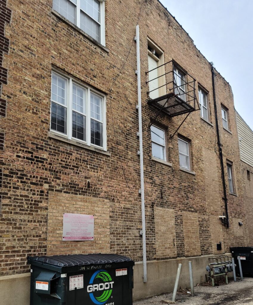 A fire escape ladder by Modum on an apartment building